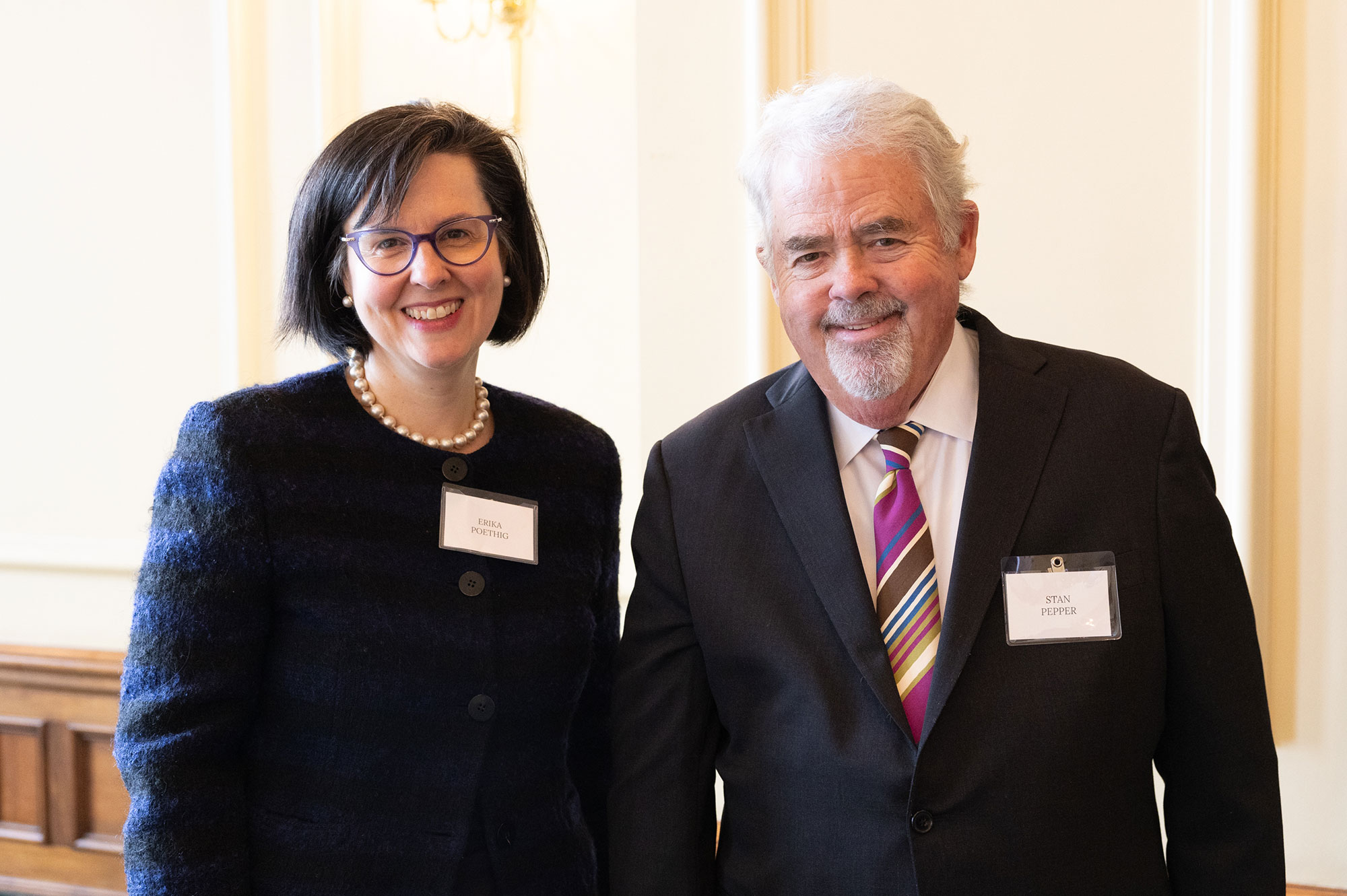 Two people standing together, facing the camera