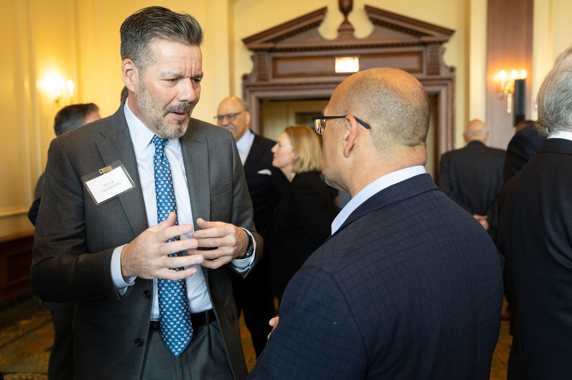 Two people standing and talking together