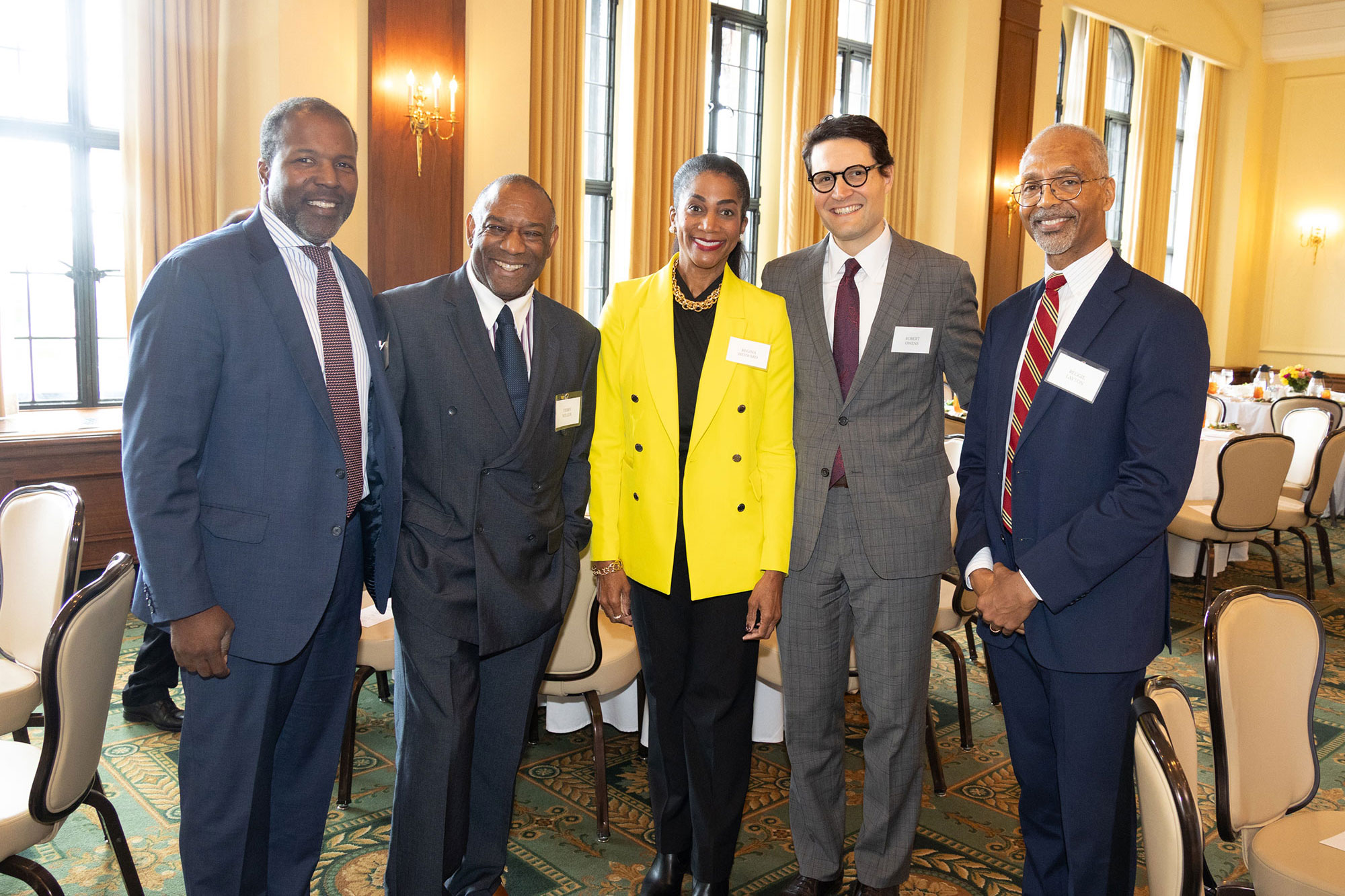 Five people stand together