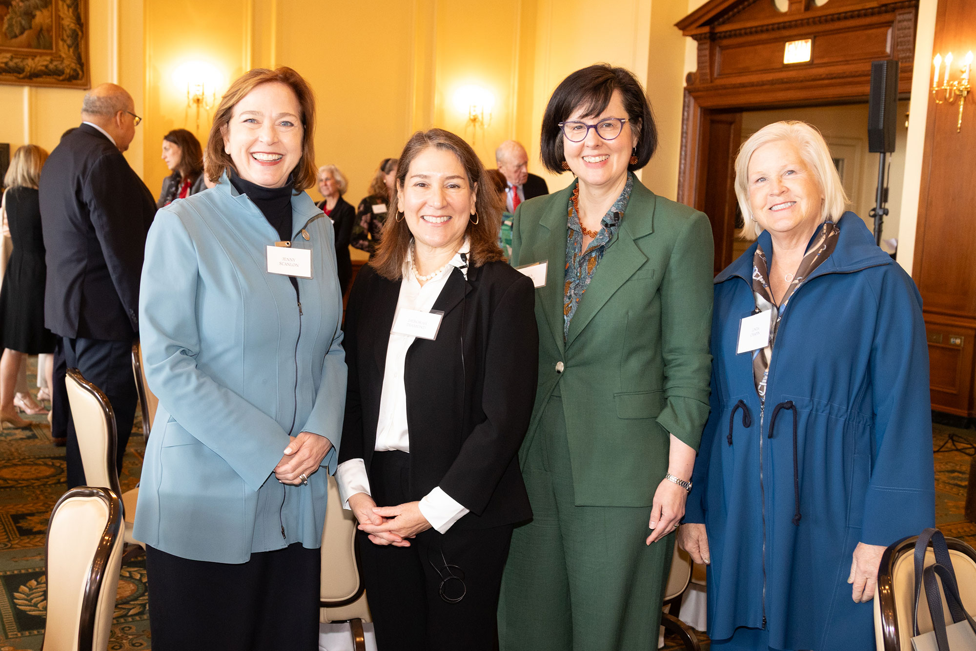 Four people standing together
