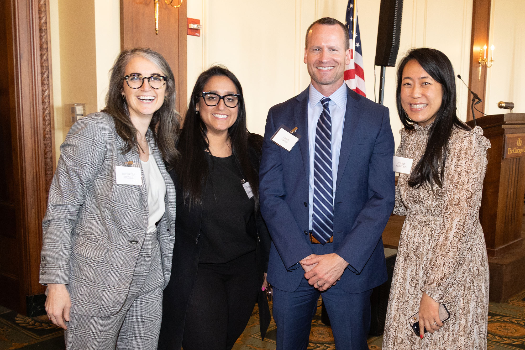 Four people standing together