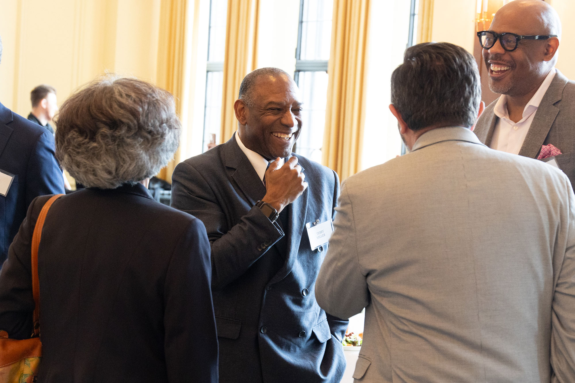 A group of people laughing and talking together