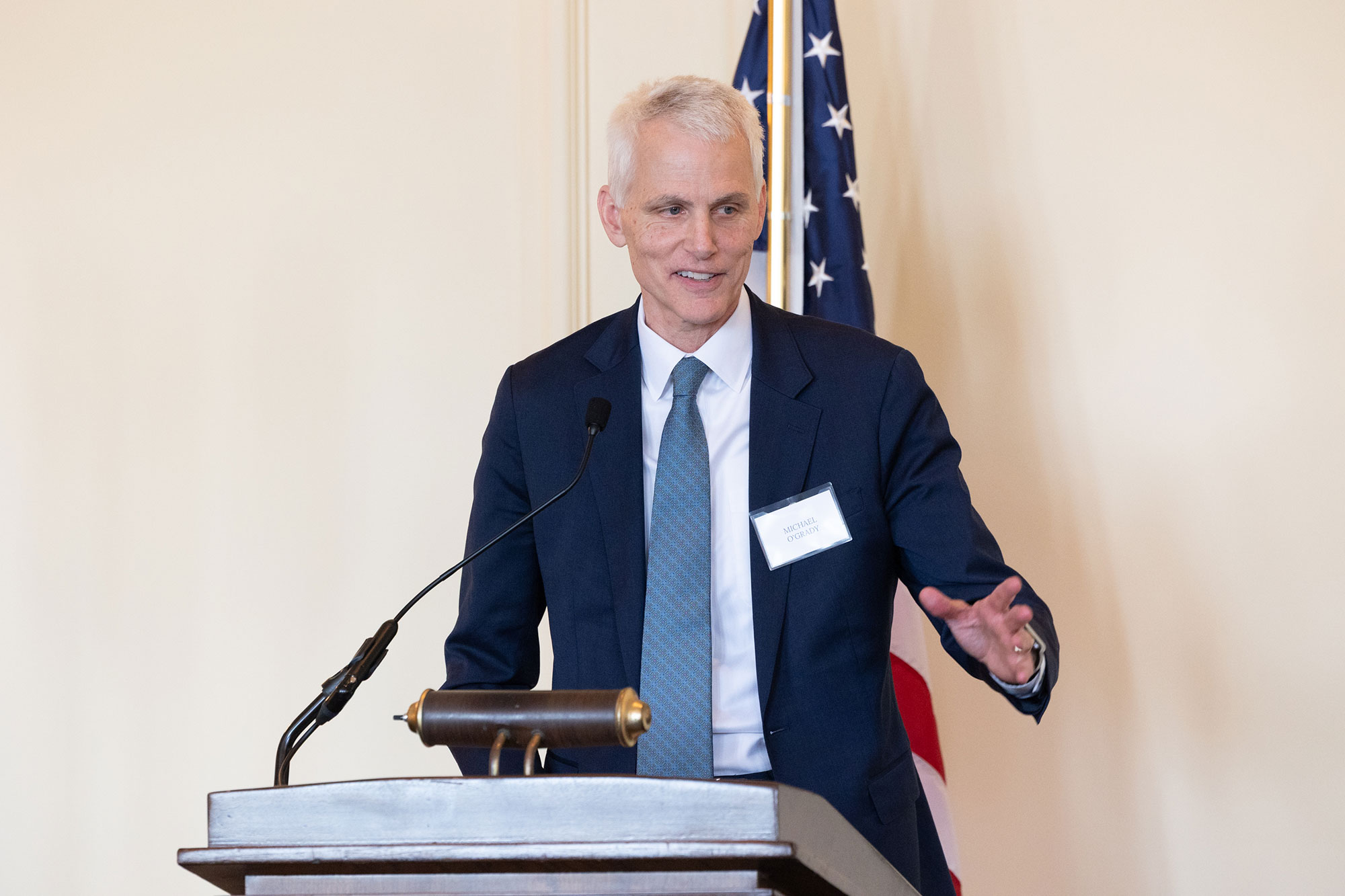 A person standing at a podium speaking