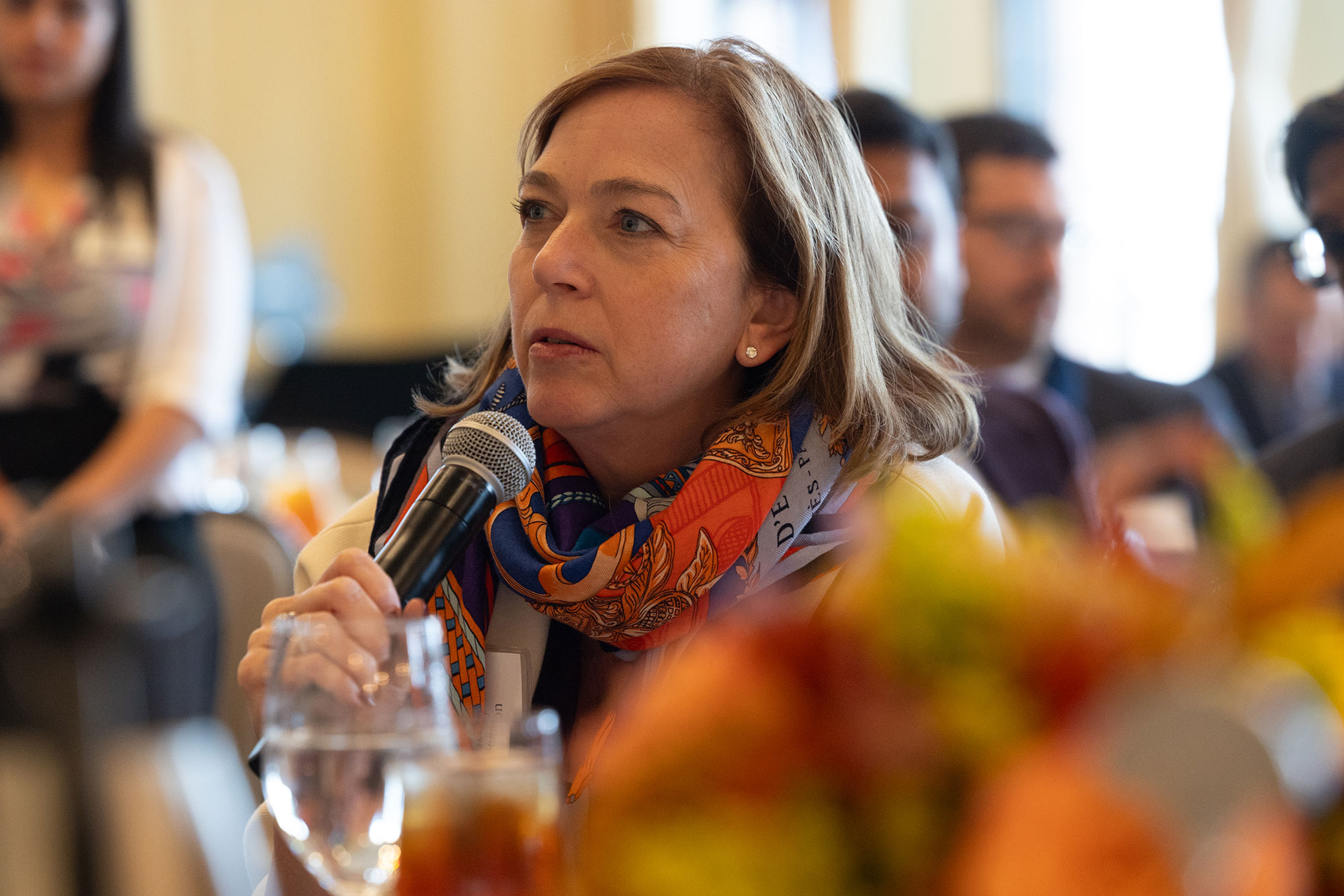 A person talks into a microphone