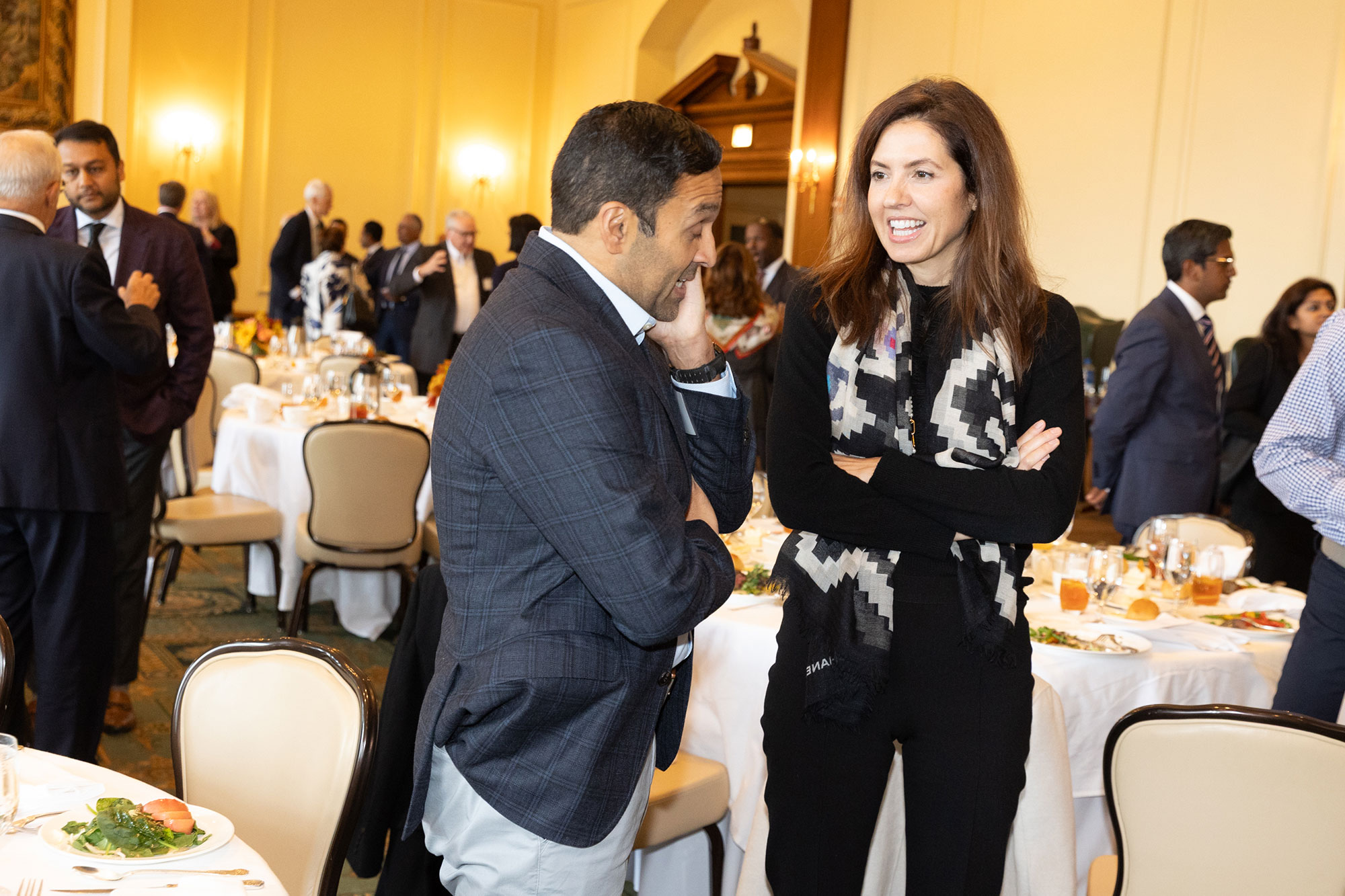 Two people stand while talking to each other