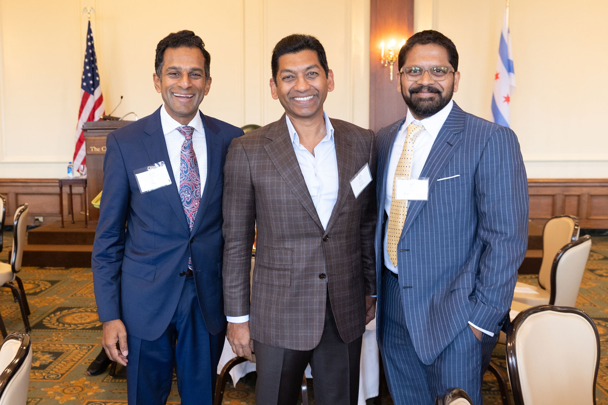 Three people stand together