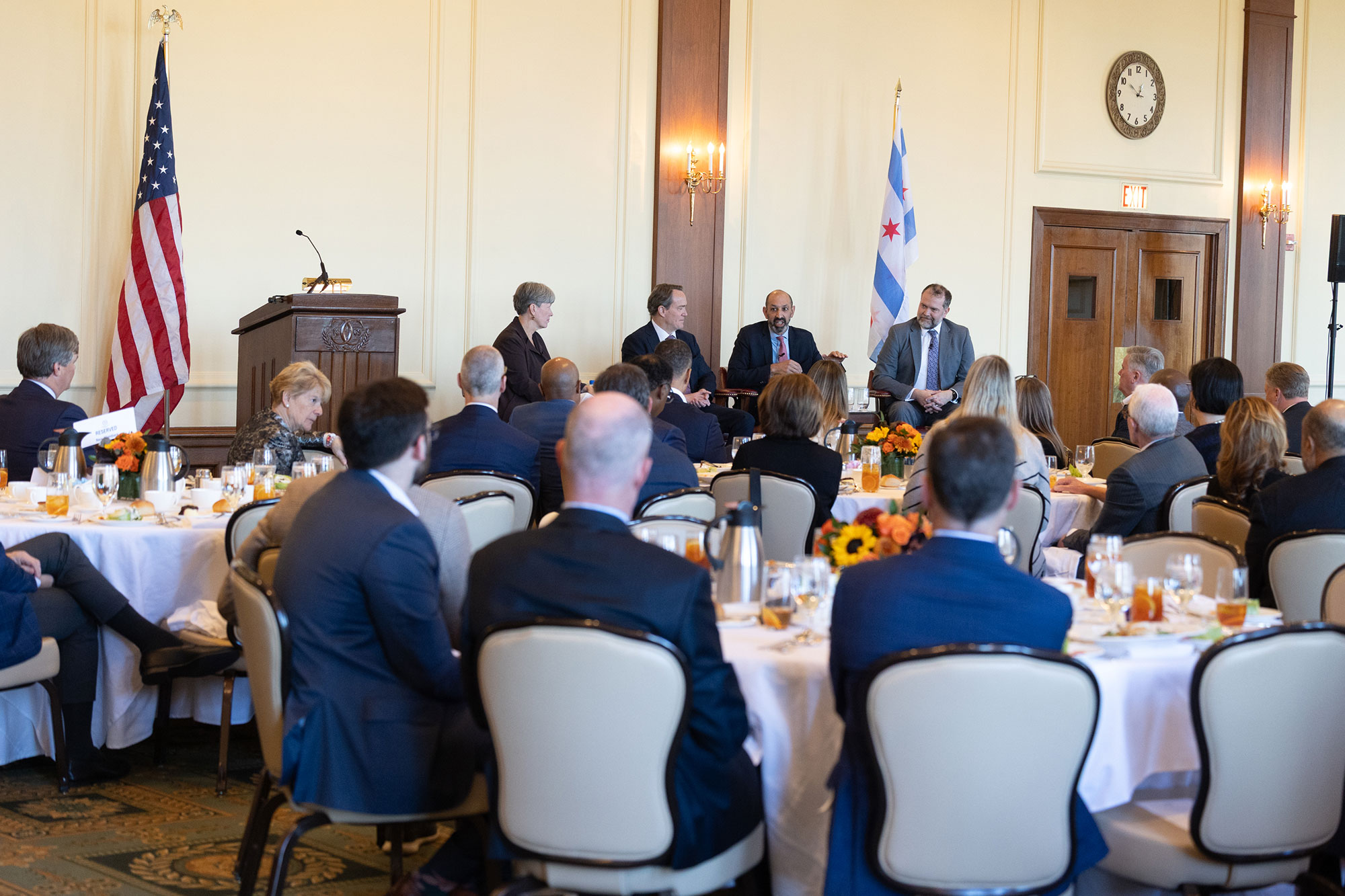 People in the audience sit at tables