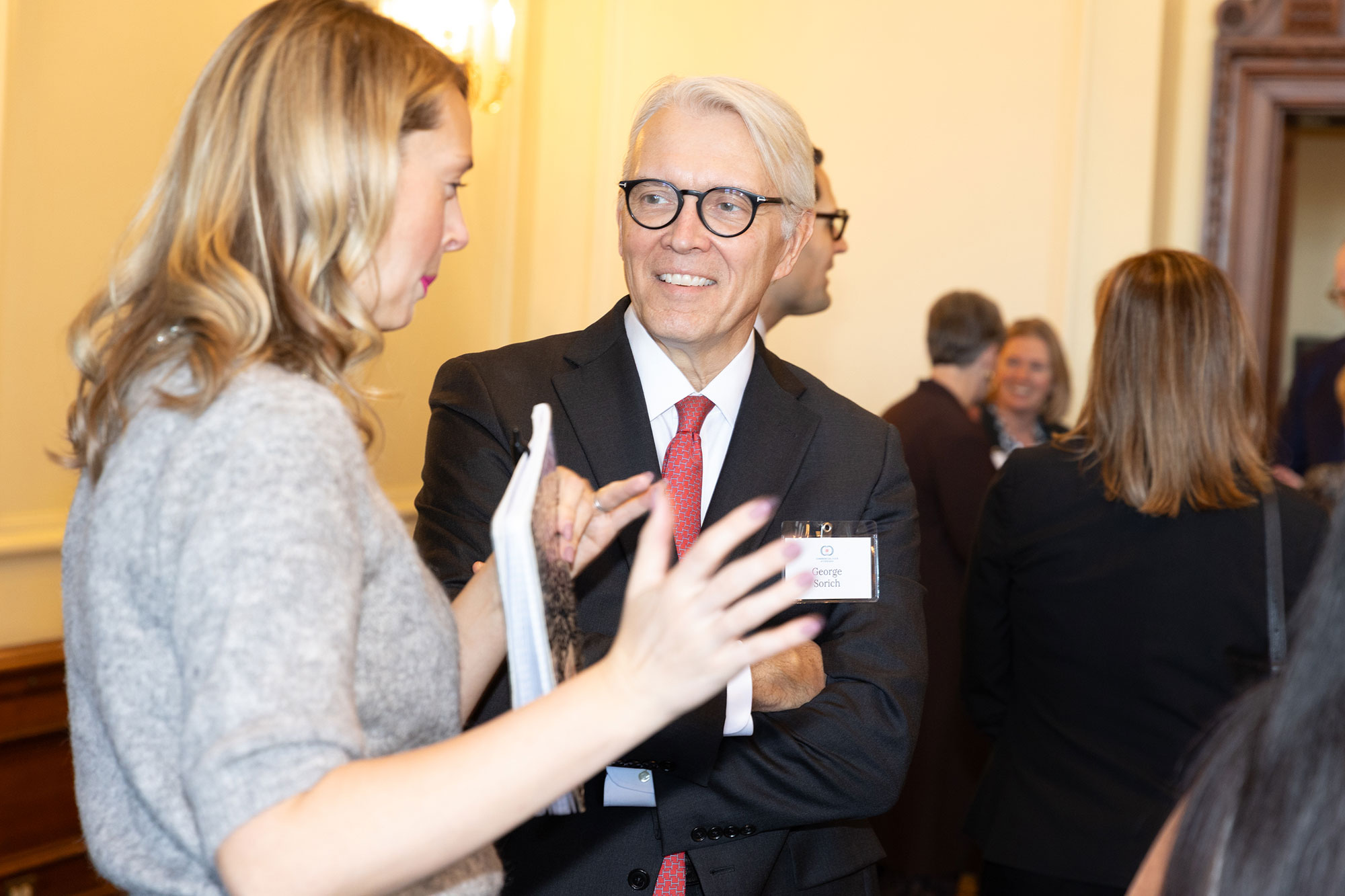 Two people talk together