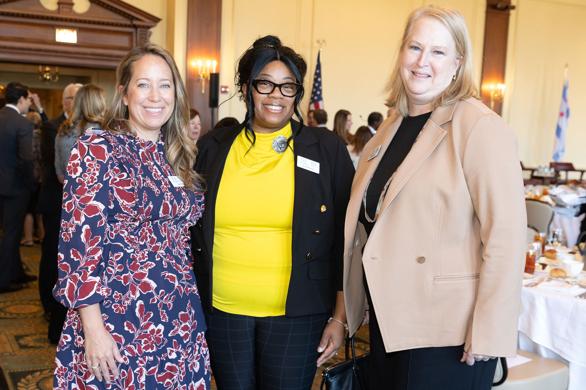 Three people stand together