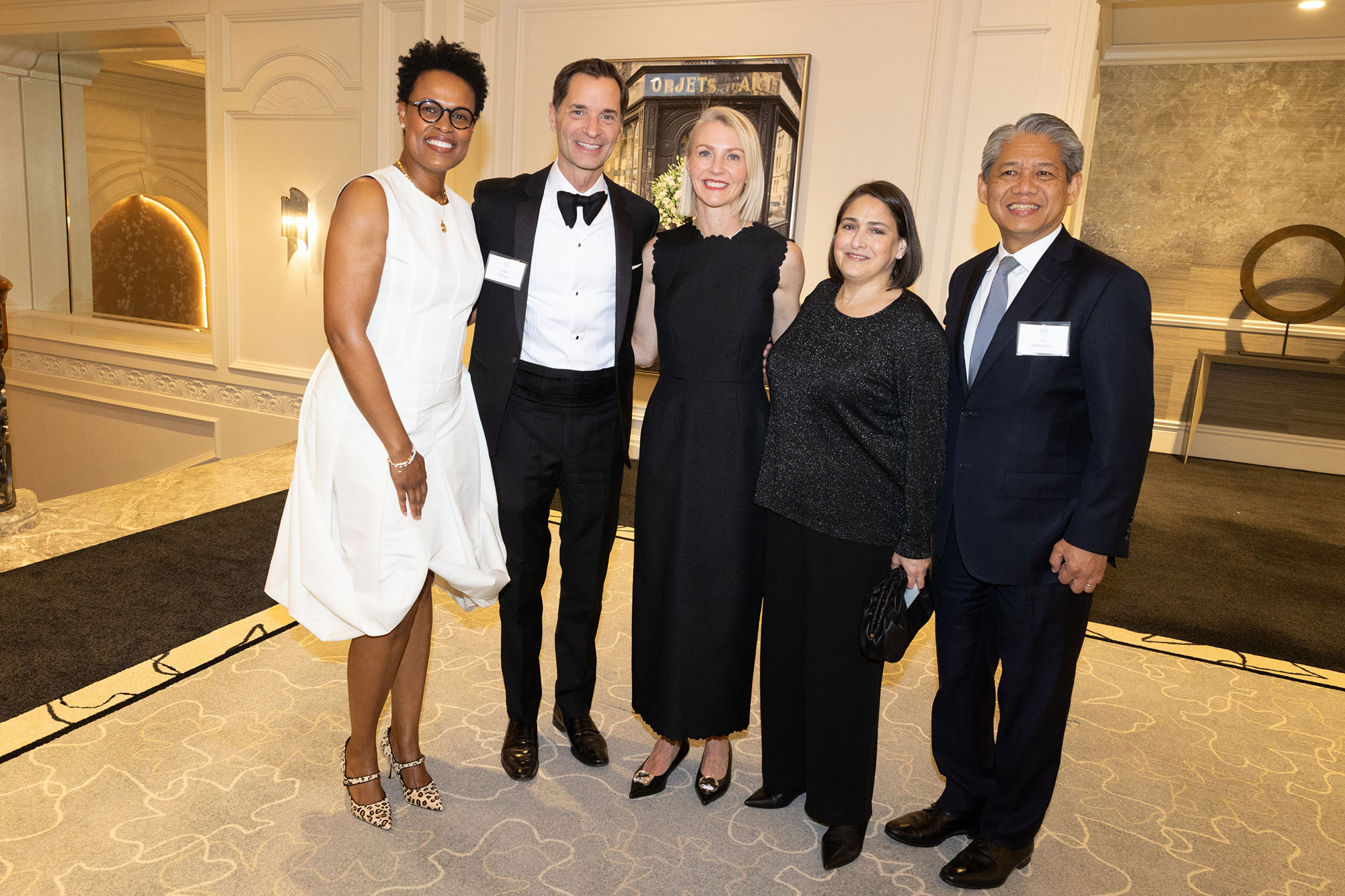 Five people stand together