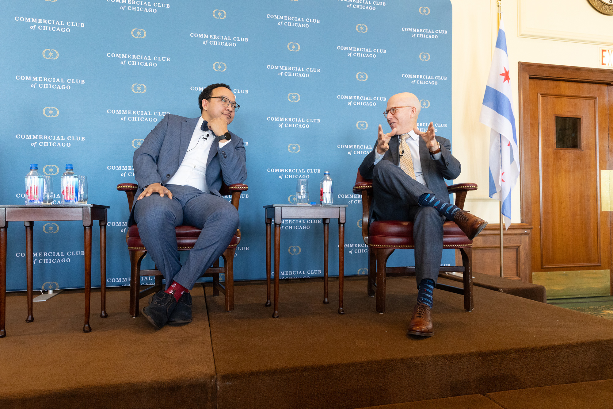 Two people talking on stage