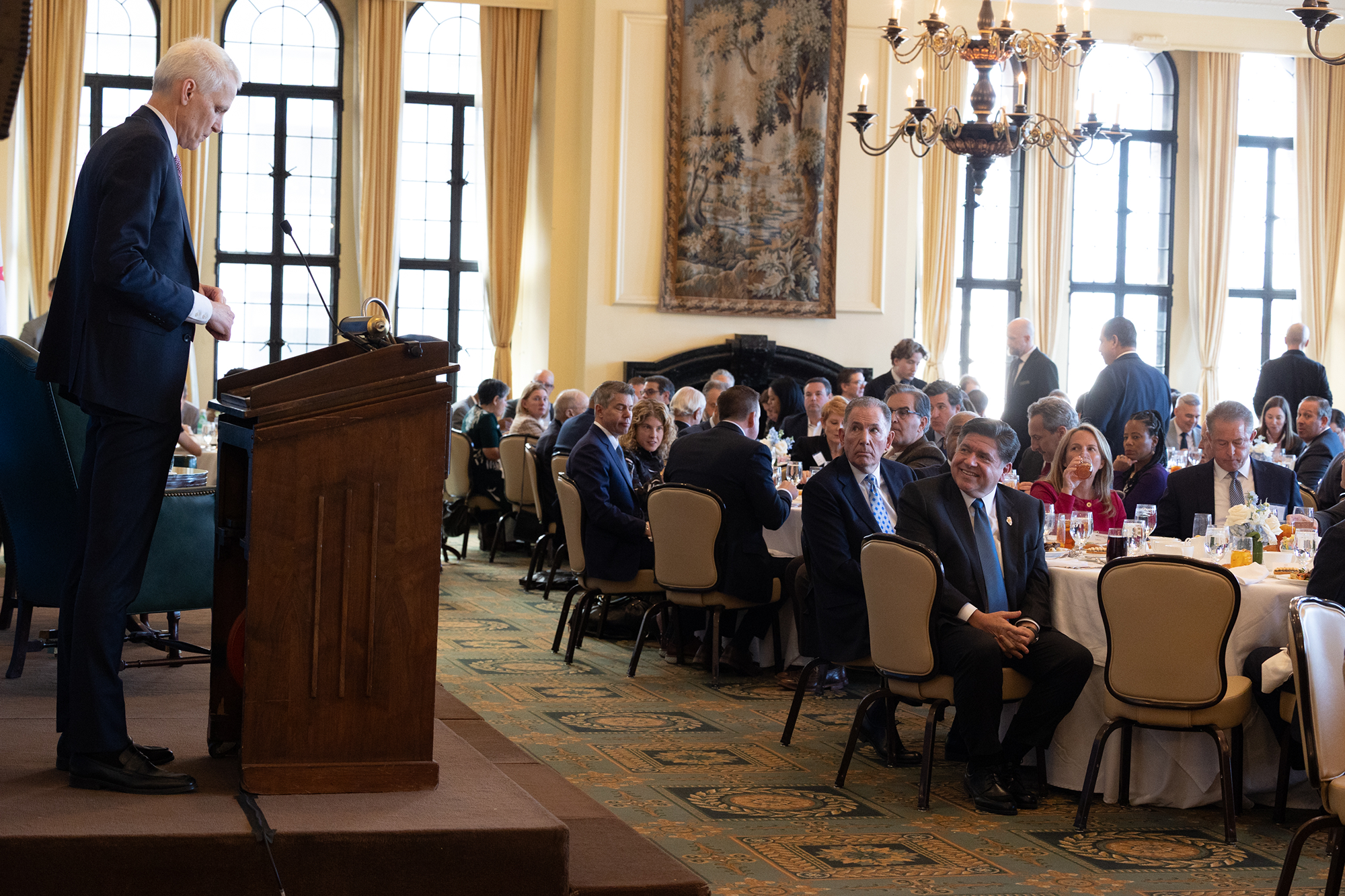 A man stands at a podium
