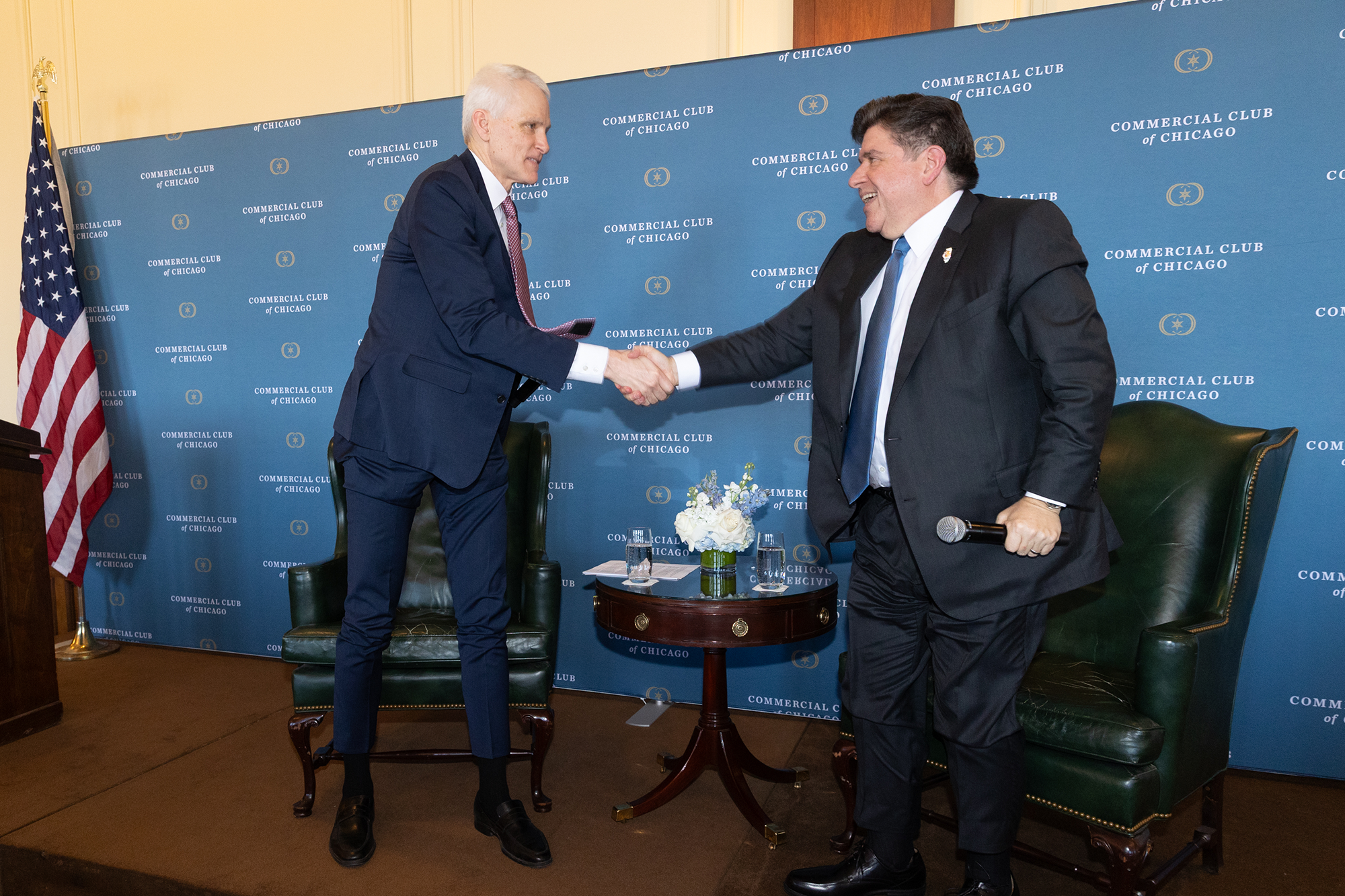 Two people shake hands