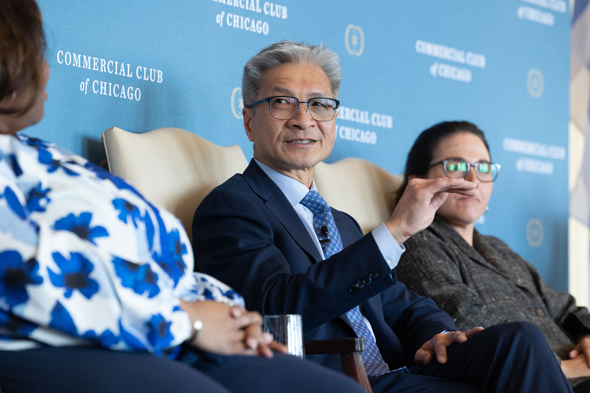 A person sitting in a chair speaks