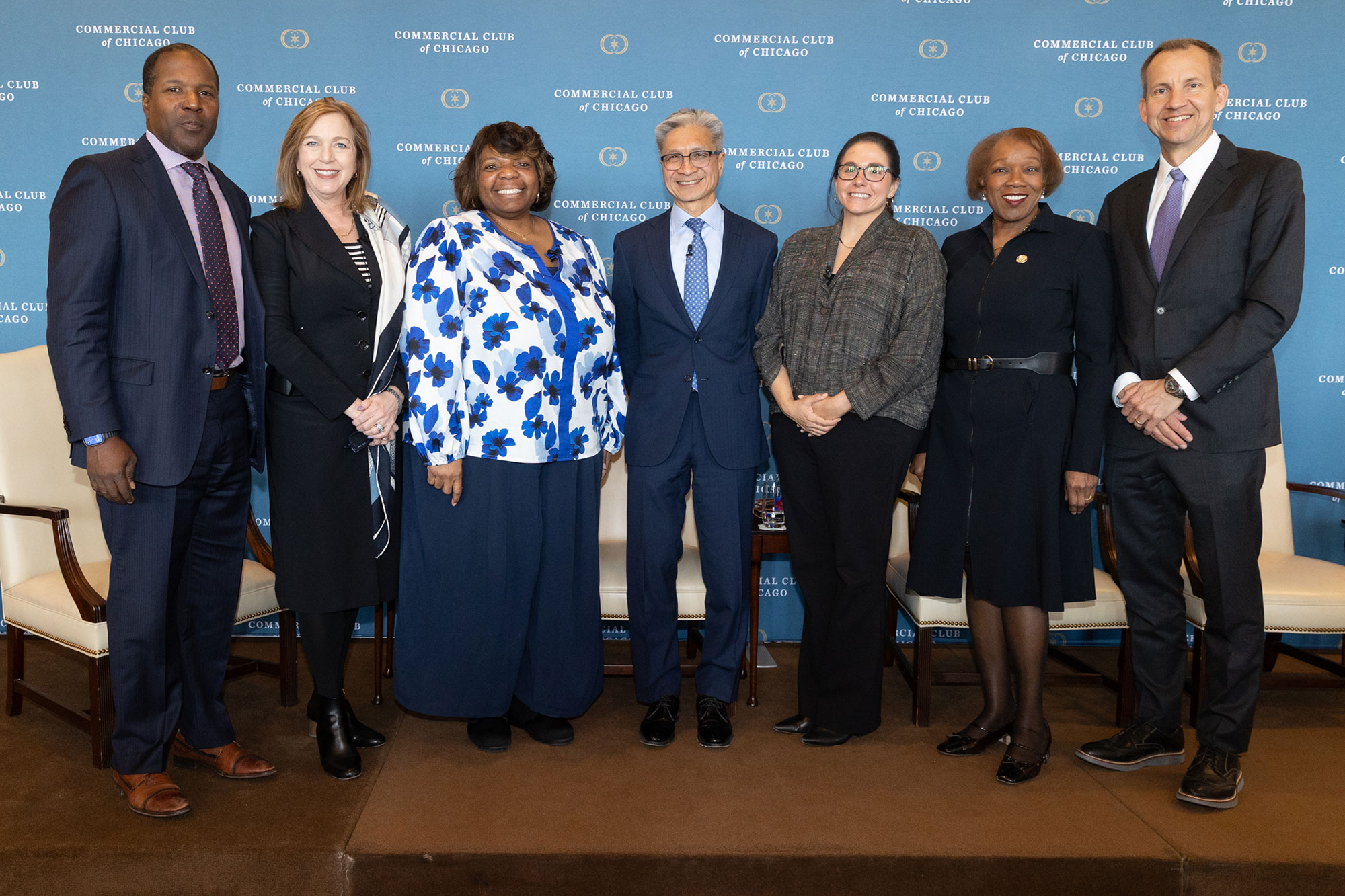 A person in the audience stands and speaks