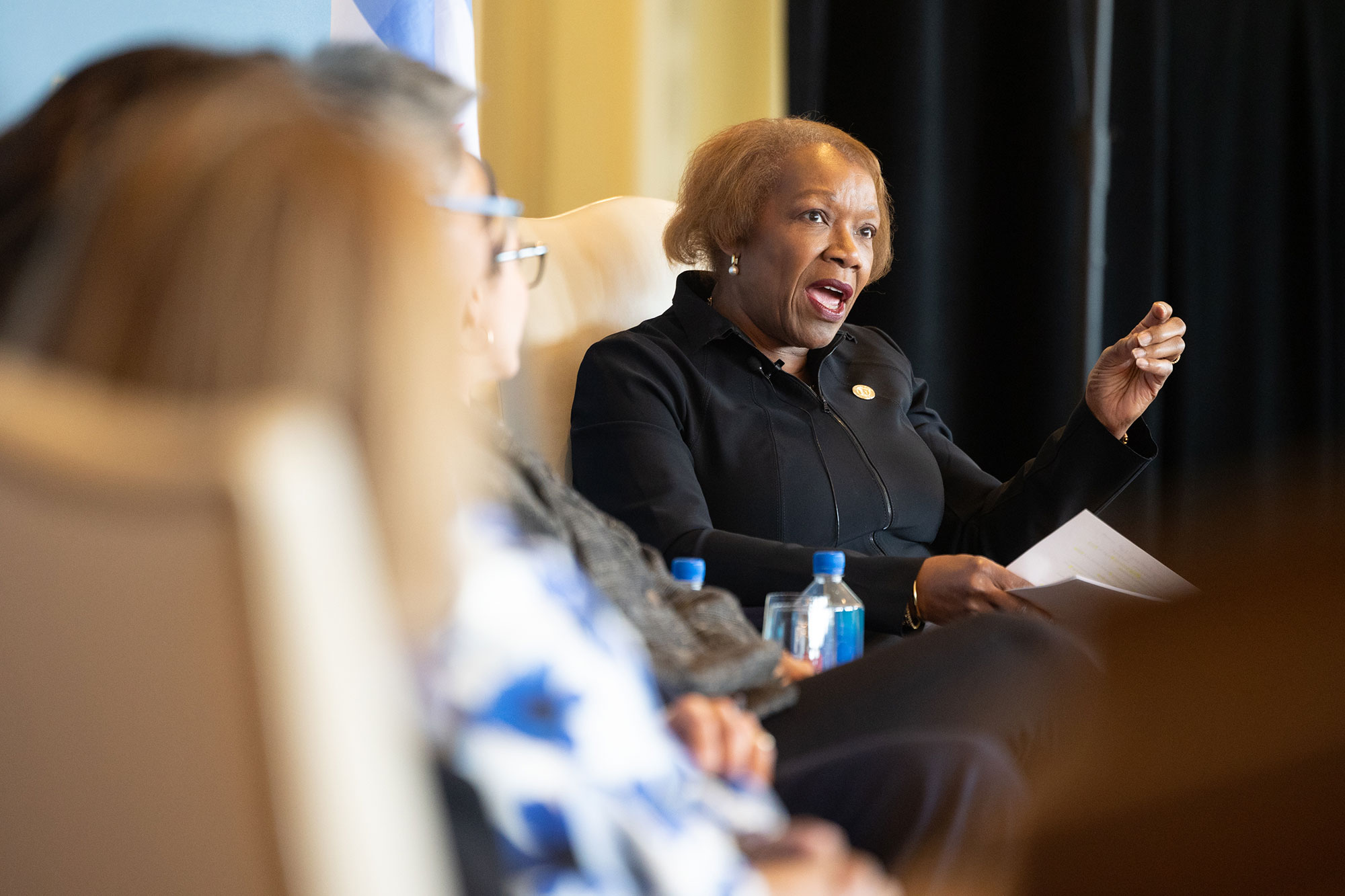 A person on stage speaking