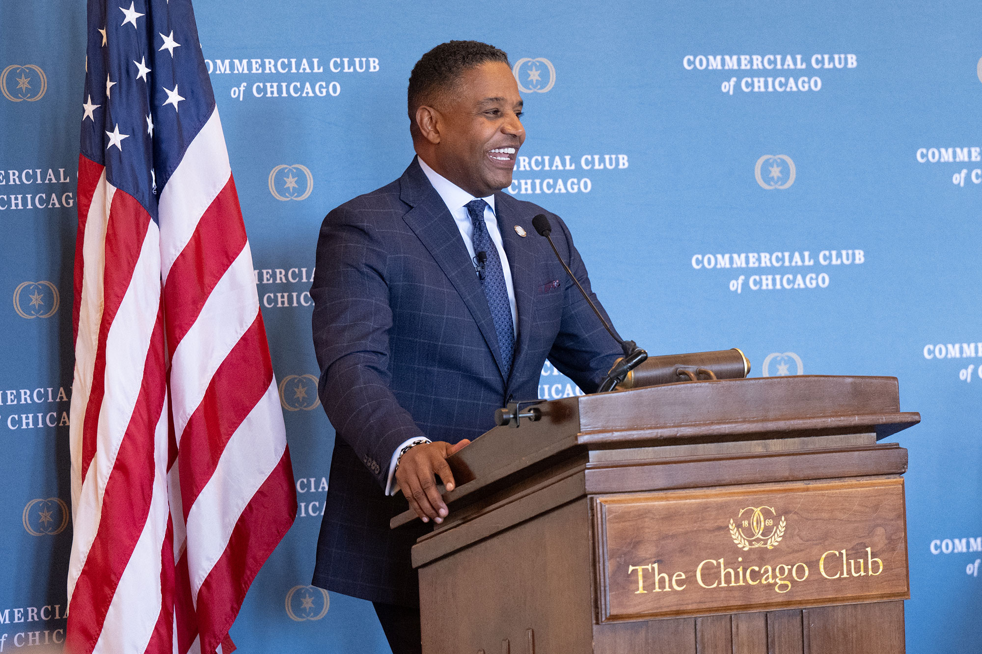 A person stands behind a podium