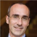 A professional headshot of a man.