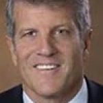 A professional headshot of a man.