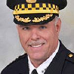 A professional headshot of a man.