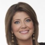 A professional headshot of a woman.