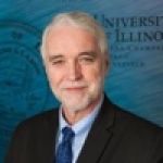 A professional headshot of a man.