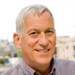 A professional headshot of a man.