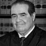 A professional headshot of a man.