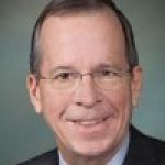 A professional headshot of a man.