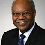 A professional headshot of a man.