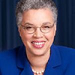 A professional headshot of a woman.