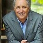 A professional headshot of a man.