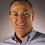 A professional headshot of a man.