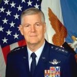 A professional headshot of a man.