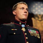 A professional headshot of a man.