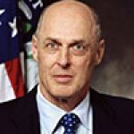 A professional headshot of a woman.