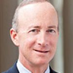 A professional headshot of a man.