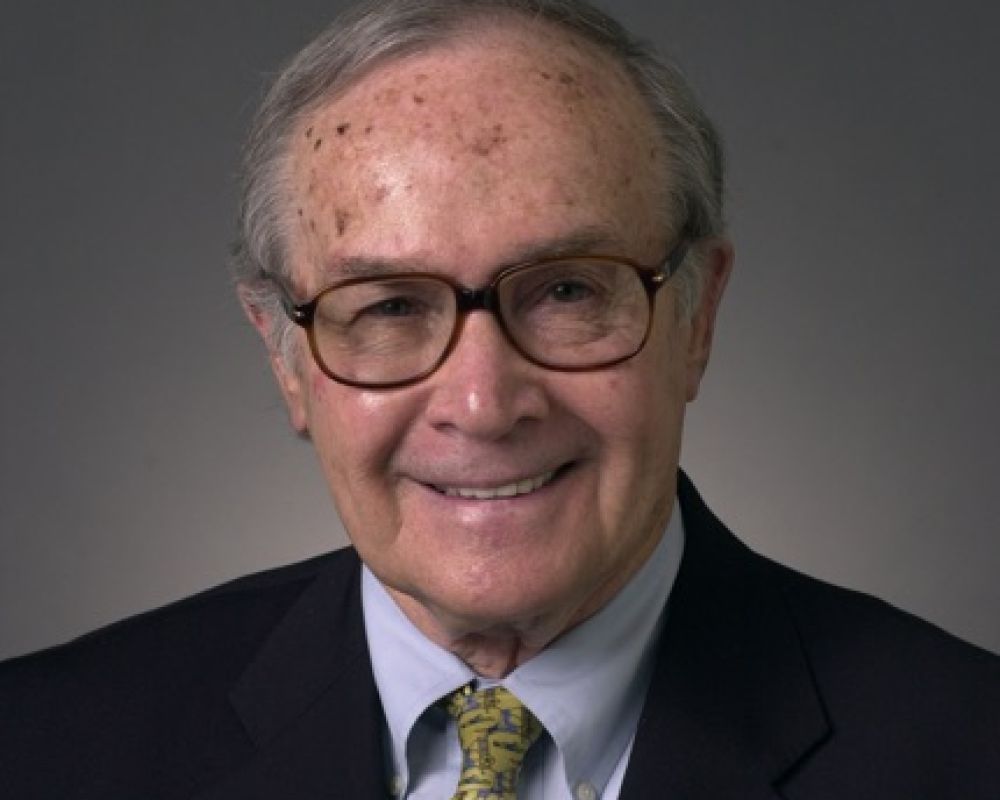 A professional headshot of a man.