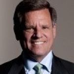 A professional headshot of a man.