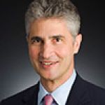 A professional headshot of a man.