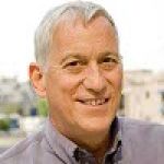 A professional headshot of a man.